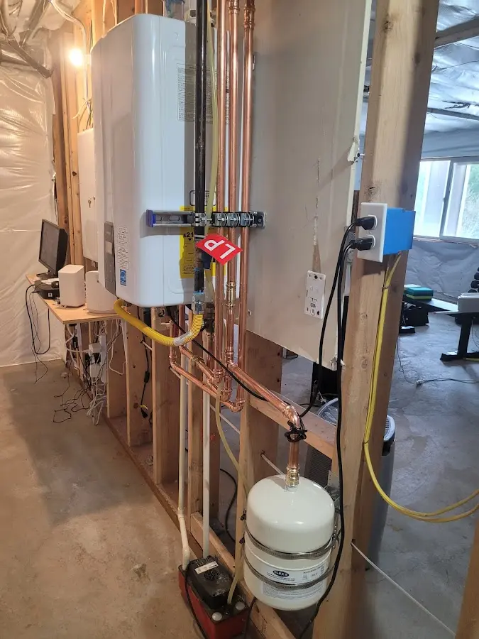 Licensed plumber repairing a kitchen sink in Corinth