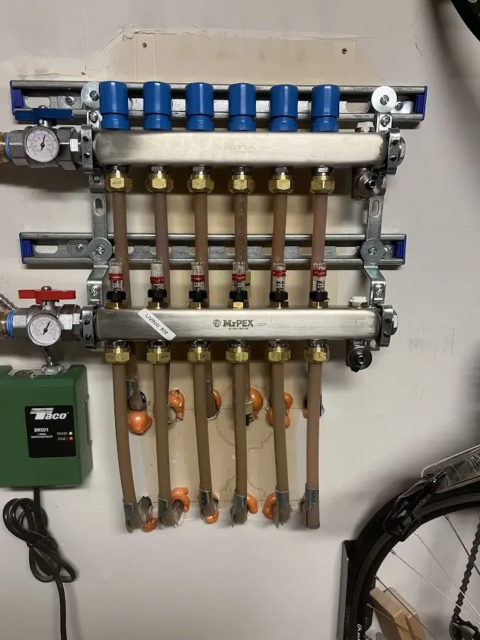 Plumber performing Water Heater Repair at a residential property in Corinth